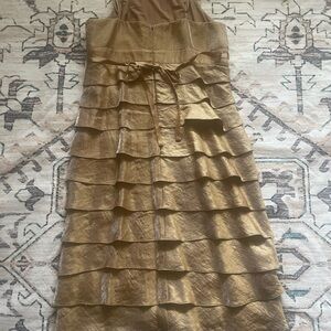 Very pretty bronze colored dress! It is a size 8. It has been worn one time.